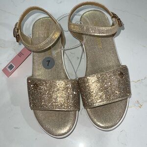 Women’s Juice Couture                                   Size: 7M   Color: Gold
